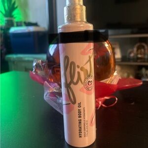 Flirt Hydrating Body Oil in Pink Bottle